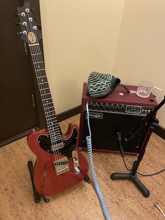 Amp and guitar, both in red